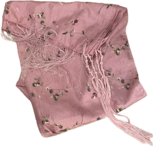 A beautiful pink shawl with pink tzitzit showing
